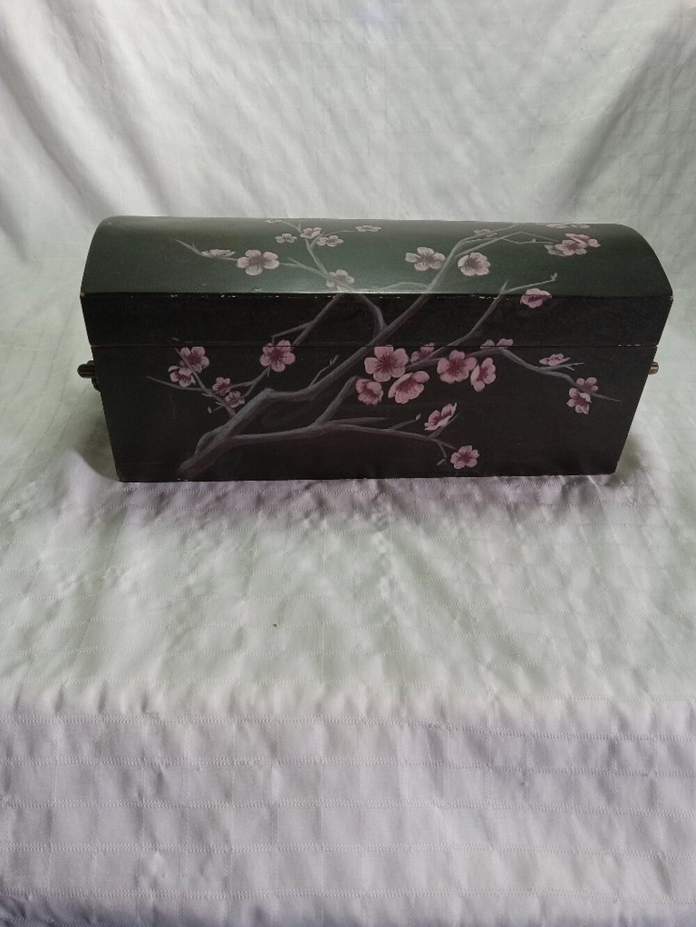 A beautiful vintage wooden chest with painted Japanese cherry blossoms